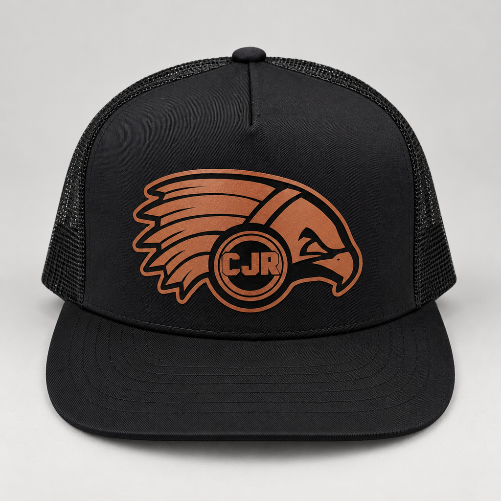 CJR brown leather hawk logo patch on a dark trucker hat